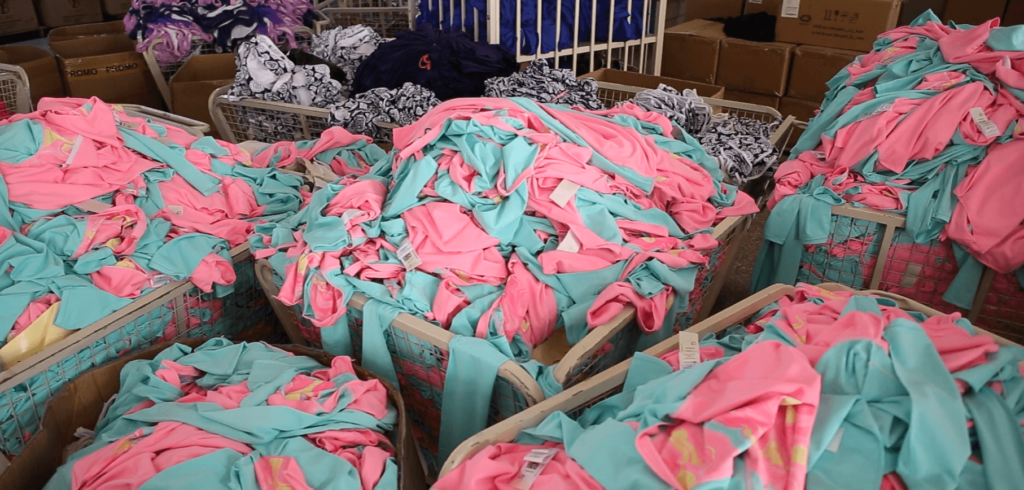 Swimwear fabric warehouse with organized nylon spandex materials