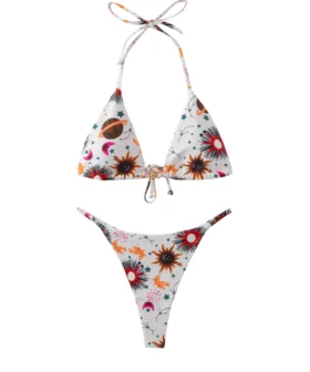 Front flat-lay of a white triangle bikini set with celestial sun, star, and planet print, featuring a gold sun-shaped metal front connector.