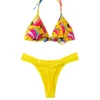 Front view of a yellow bikini set with a colorful patterned triangle top and solid yellow ruched bottoms.