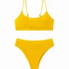 Full front flat-lay view of a solid yellow ribbed two-piece bikini set with thin straps on a white background.