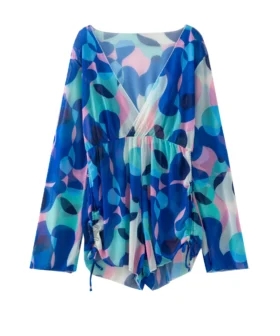 Front flat-lay of a long-sleeve cover-up with a geometric abstract print, paired with a matching halter triangle bikini top and bottom.