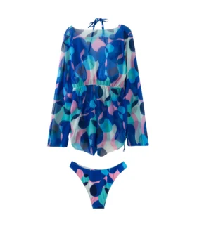 Front view of the abstract print cover-up highlighting the V-neckline, ruched waist, and side tie details.
