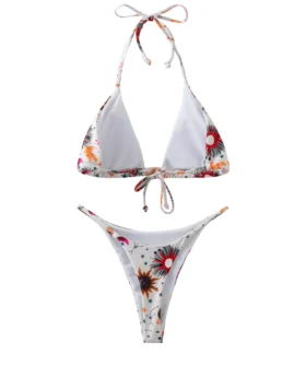 Back flat-lay view of a white celestial print bikini set, showing the white inner lining and tie straps.