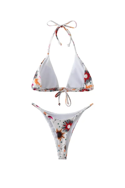 Back flat-lay view of a white celestial print bikini set, showing the white inner lining and tie straps.