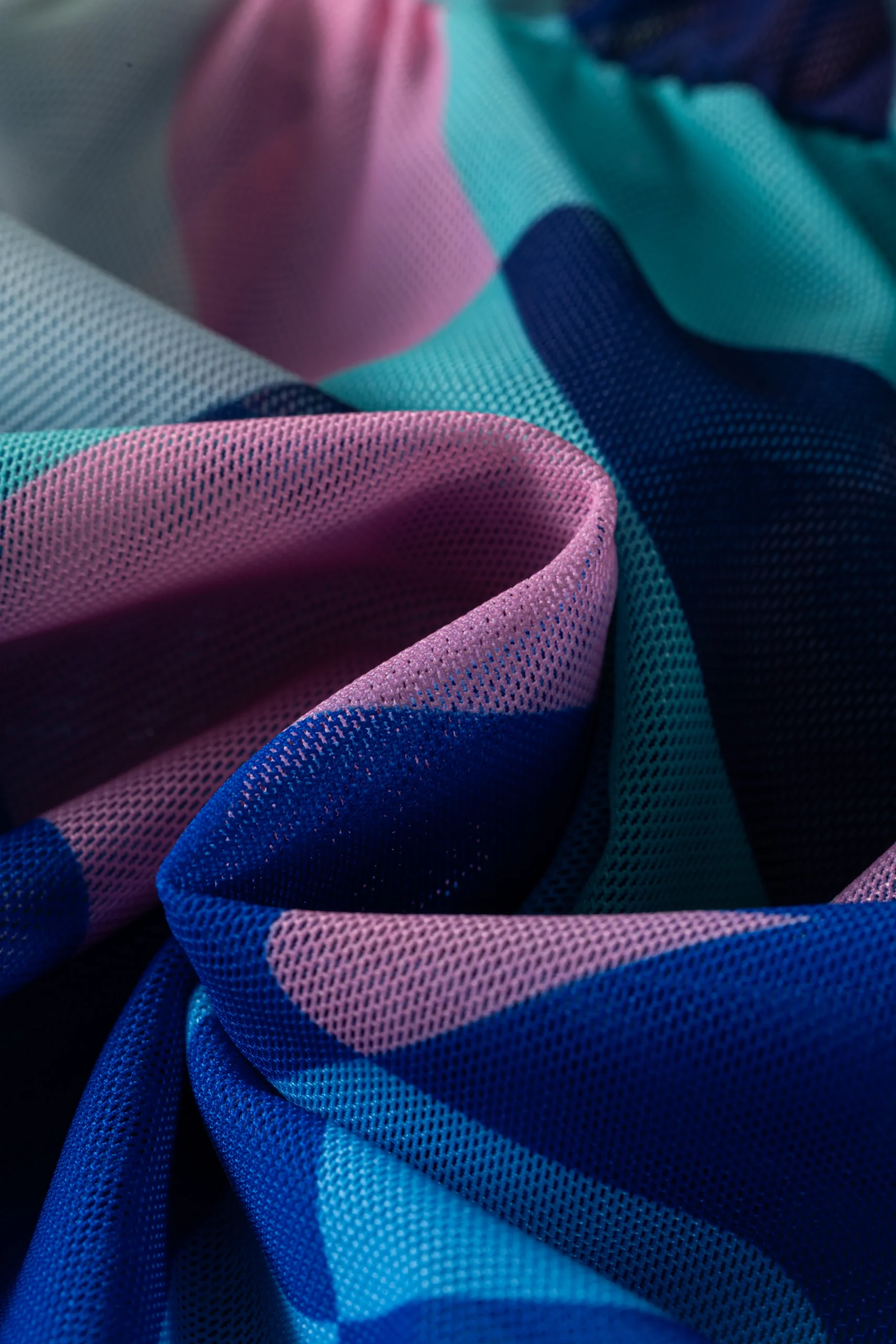 Back flat-lay view of the abstract print cover-up and bikini bottom, showing the halter tie knots.