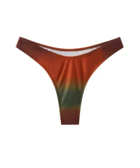 Front flat-lay of a high-cut ombre bikini bottom in rust, orange, and olive gradients with zigzag seams.