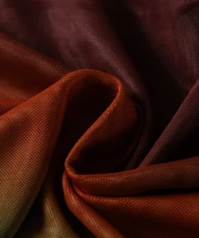Macro close-up of the ombre bikini fabric bunched and folded, showcasing its fine micro-mesh texture and woven surface.