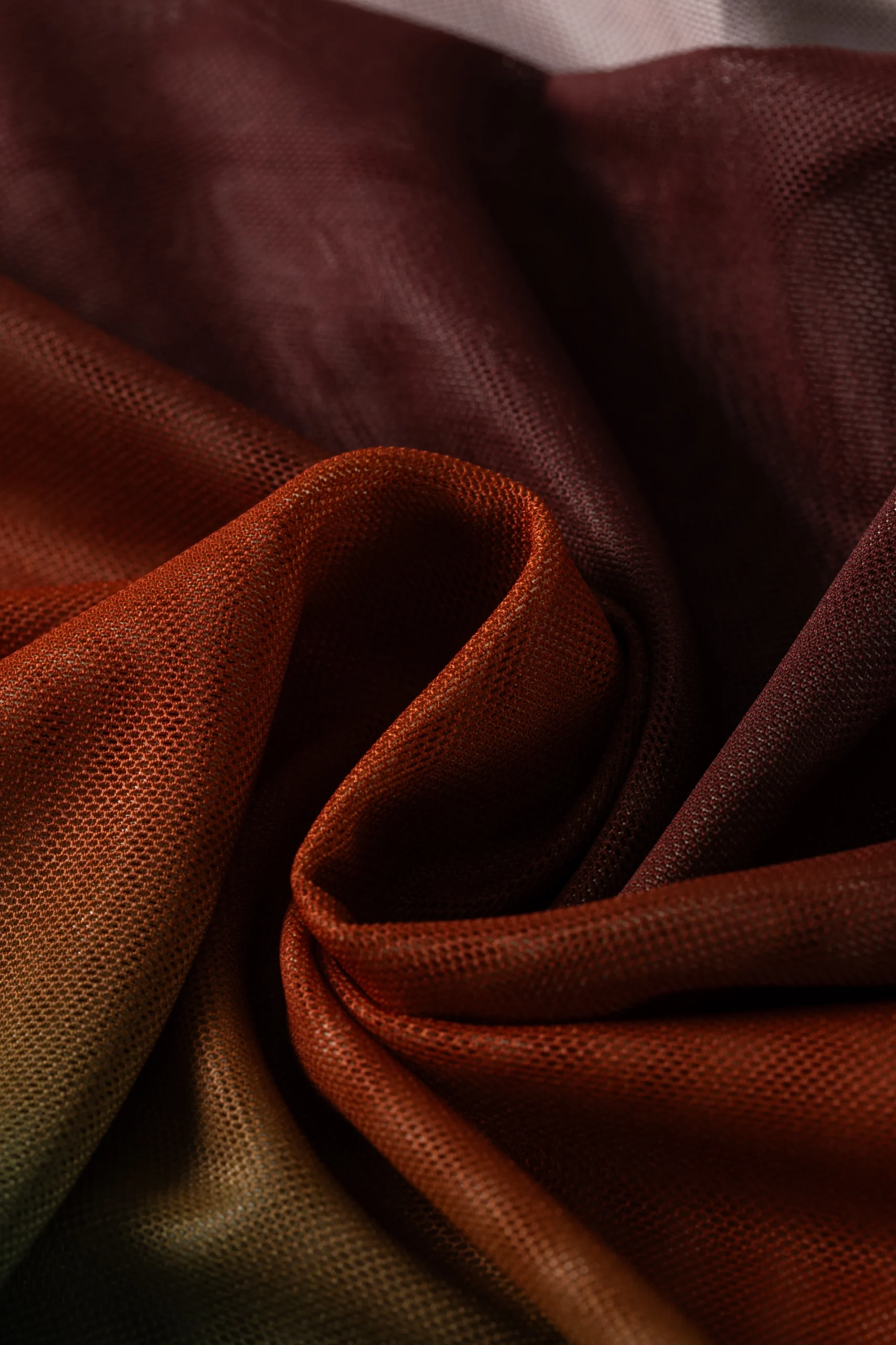 Macro close-up of the ombre bikini fabric bunched and folded, showcasing its fine micro-mesh texture and woven surface.