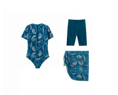 Front flat-lay of the teal tropical leaf print side-tie sarong skirt.