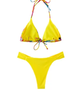 Front flat-lay of a yellow triangle bikini set with colorful patterned tie strings and solid yellow ruched bottoms.
