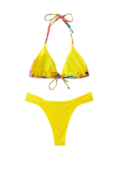 Front flat-lay of a yellow triangle bikini set with colorful patterned tie strings and solid yellow ruched bottoms.